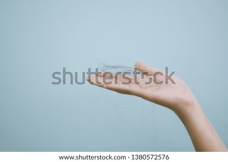  woman with brush, closeup. Hair loss problem