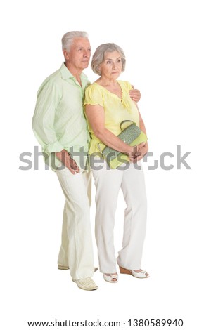 Portrait of happy senior couple posing isolated on white background