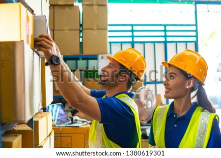 
Warehouse worker checking stock products in store