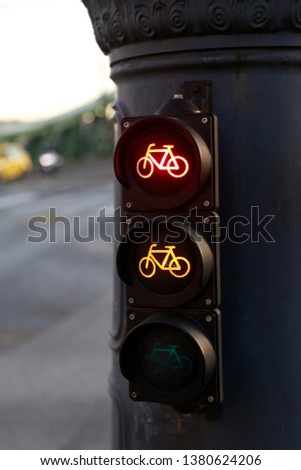 Traffic light for bicycles. Red and orange lights on.