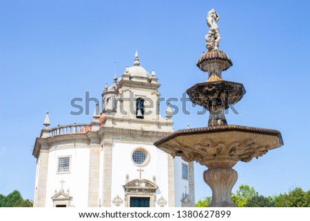 Fountain Largo da Porta Nova and church Bom Jesus da Cruz in background, Barcelos, Portugal