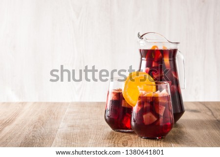 Red wine sangria in glasses on wooden table. Copyspace Royalty-Free Stock Photo #1380641801