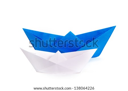 White and blue paper ships on a white background