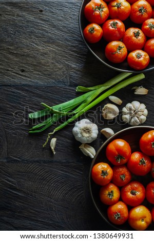 Raw Ingredients for Tomato Soup Contains Fresh Red Tomatoes, Garlic, Leek in Wood Background Texture