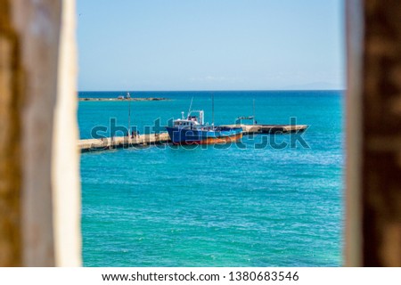 fishing boat anchored at the dock, pampatar bay, margarita island, venezuela