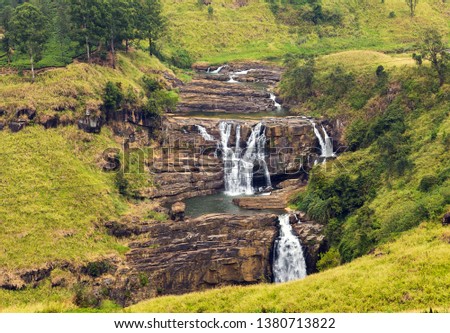Famous tourist attractions deep forest waterfall landmarks destination. Panoramic Mountain river waterfall landscape.