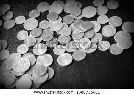American cents on a dark surface close up. Black and white