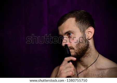 guy with a nose trimmer