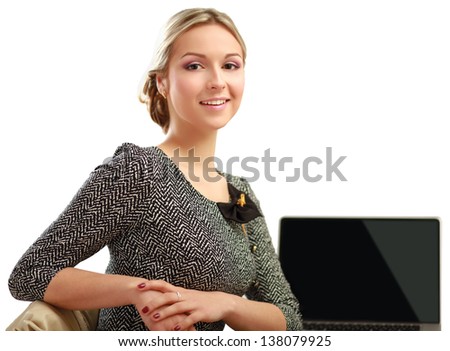 A young woman with a laptop sitting isolated on white background