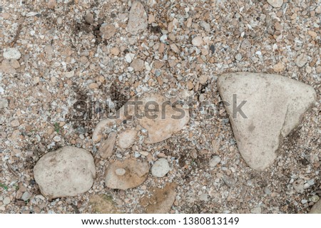 Natural big and small stones background grey color. Natural texture.