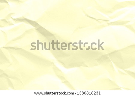 Paper beige color is crumpled and aged. The texture of the surface is old and wrinkled in vintage retro style.