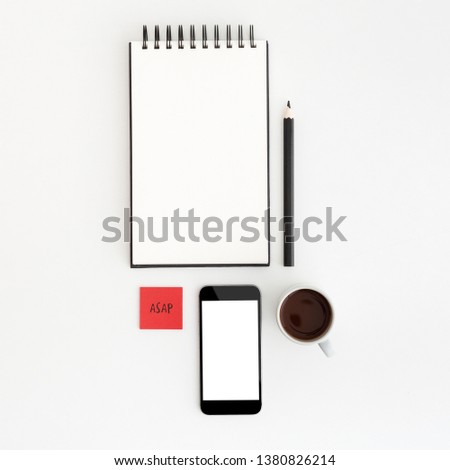 Flat lay image of minimal workspace. with notebook paper, cafe, mobile screen for mock up.