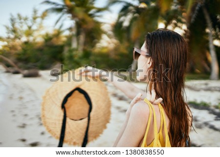    beautiful woman with a hat on her shoulder bag nature                           