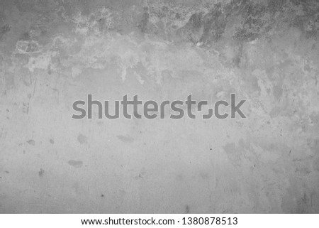 The texture of the old cement wall with scratches, cracks, dust, crevices, roughness, stucco. Can be used as a poster or background for design.