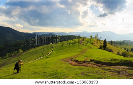 Photographers take pictures of spring rural landscape in the Mizhhiria, Carpathian mountains