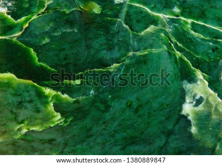 Abstract background. Polished surface of natural dark green jade Royalty-Free Stock Photo #1380889847