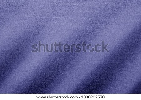 Plastic glittering texture in blue tone. Abstract architectural background and texture for design.