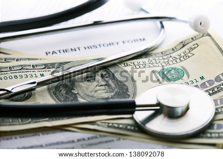 Patient history, stethoscope and dollars. Medical concept.