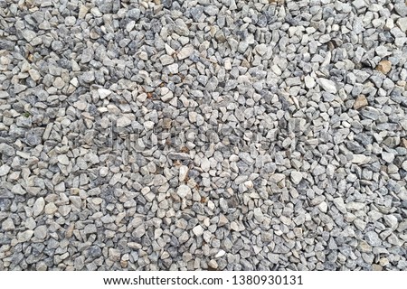 small road stone background, dark gravel pebbles stone texture seamless texture Royalty-Free Stock Photo #1380930131