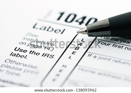 Income tax form and pen. Finance concept. Royalty-Free Stock Photo #138093962
