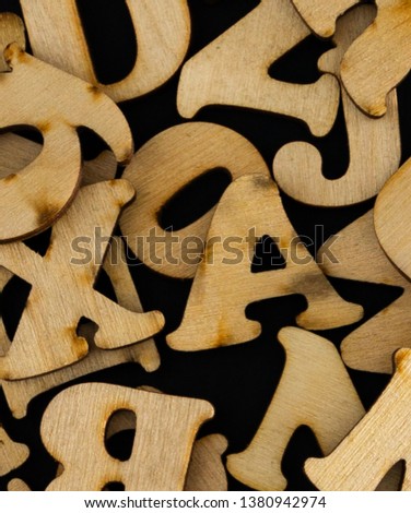 wooden letters on black and blue floor