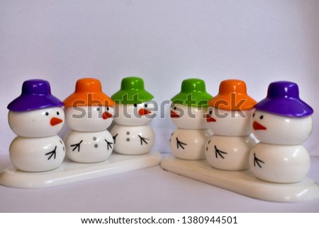 beautiful snowmen with colorful caps