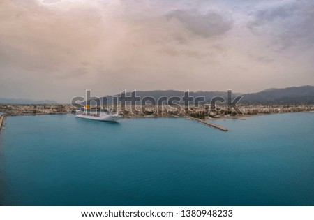 Aerial panoramic view of the beautiful coastal city of Kalamata, Messenia, Greece and the port in a typical summer day. Amazing view over the Messenian Gulf in Greece
