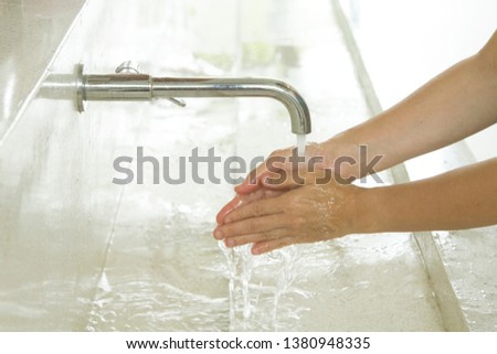 Close-up of hand washing for infectious preventing Royalty-Free Stock Photo #1380948335