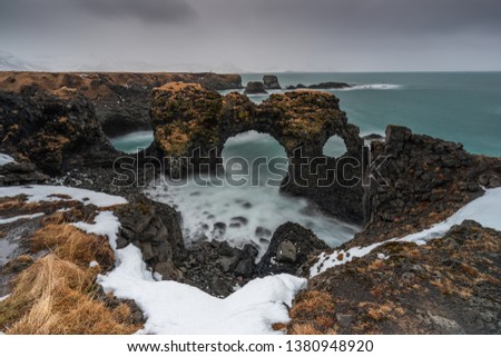Gatklettur rock during winter storm