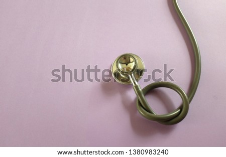 copy space and top view Stethoscope on Purple background. space for text