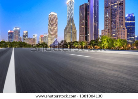 Motion blurred highway and skyline of modern urban buildings in Shanghai