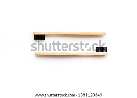 bamboo dental cleaning brush for zero waste lifestyle concept on white background top view
