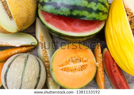topview on a lot of different fresh melons, some are sliced, flat lay Royalty-Free Stock Photo #1381133192