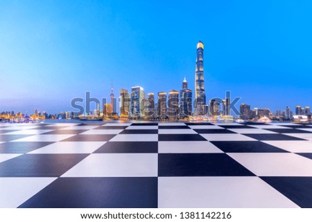 Shanghai modern commercial office buildings and square floor at night