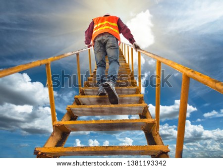 workers, engineering routine working attending to climb high stair ladder aim to reach successfully of life, progress of life in hard and competition of working concept Royalty-Free Stock Photo #1381193342