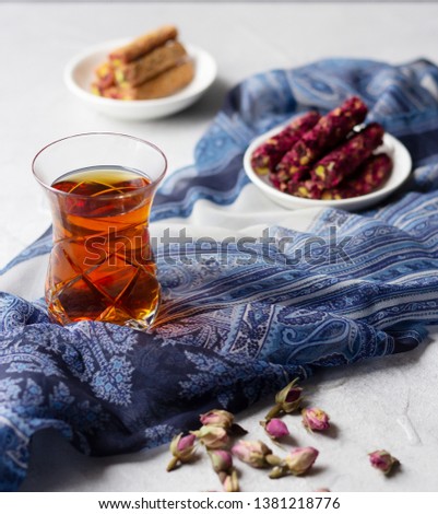 Traditional oriental glass with tea and Turkish delights lokum. Set to start Iftar during  month of Ramadan