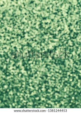 green glitter texture background. Selective focus.Shallow dof.