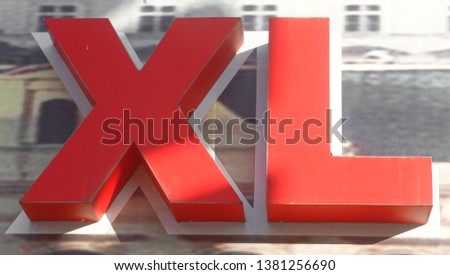 Letters of the big size of X and L red in color with a shadows