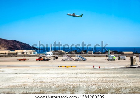 Desk of free space and airport background 