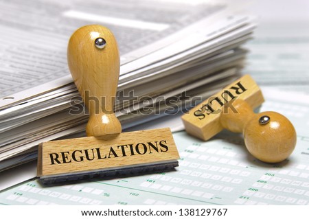 rules and regulations marked on rubber stamp Royalty-Free Stock Photo #138129767