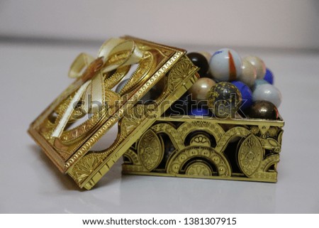 Colorful Marbles With Golden Box  