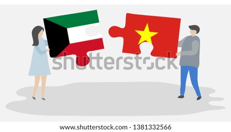 Couple holding two puzzles pieces with Kuwaiti and Vietnamese flags. Kuwait and Vietnam national symbols together.