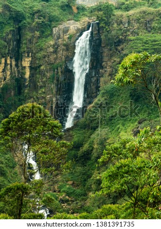 rocky mountains clear water deep forest waterfall. nature landscape beutiful waterfall.