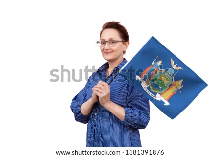 New York flag. Woman holding New York state flag. Nice portrait of middle aged lady 40 50 years old holding a large state flag isolated on white background.
