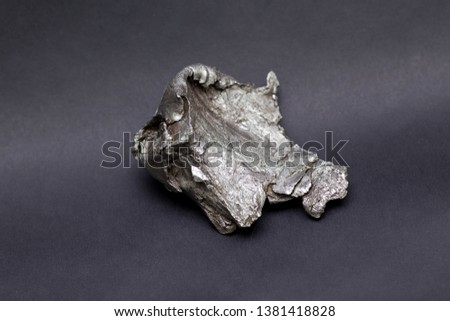 Tektite Meteorite Sikhote Alin isolated on gray background