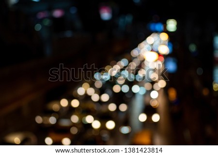 light night city bokeh abstract background glittering stars on bokeh. Orange bokeh in the bottom of the picture. Has a black background Blur - Image