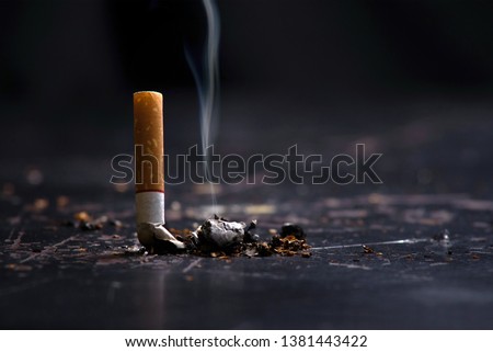 World No Tobacco Day Concept Stop Smoking.tobacco cigarette butt on the floor Royalty-Free Stock Photo #1381443422