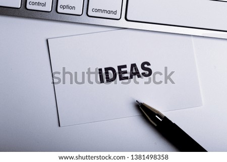 The word "Ideas" concept on paper background