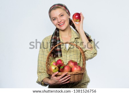 orchard, gardener girl with apple basket. organic and vegetarian. healthy teeth. vitamin and dieting food. Happy woman eating apple. spring harvest. summer fruit. Snack for business productivity.