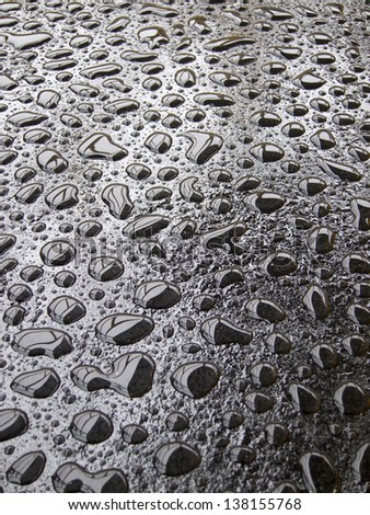Texture water drops, rain, on black metal